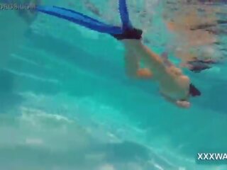 Sensational brunette harlot Candy swims underwater